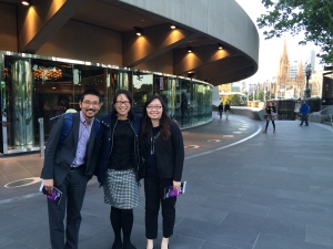 Joonhee Lee, Lily Wang, and Zhao 'Ellen' Peng in front of Hamer Hall in Melbourne